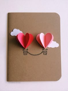 valentine's day card with paper hearts attached to them