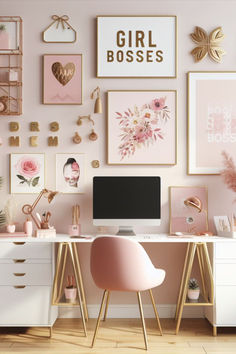 there is a desk with a computer on it in front of some pictures and pink chairs