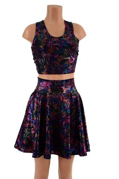 This two piece set includes a racerback crop, AND a circle cut skater skirt.  With POCKETS!  Wear them together or separately, this fabric has such a pretty multi color print, it matches with anything!Made to order, ships out within five days of purchase.Womens Sizing (See below for instructions on where measurements should be taken)XXS: Bust 29"-30" / Waist 22"-23" / Hips 30"-32"Extra Small: Bust 31"-32" / Waist 24"-25" / Hips 33"-35"Small: Bust 33"-34" / Waist 26"-28" / Hips 36"-37"Medium: Bus Fitted Sleeveless Rave Crop Top, Spring Sleeveless Rave Crop Top, Monster High Crop Top, Cosmic Crop Top, Multicolor Graphic Print Crop Top, Racerback Top, Skirts With Pockets, Skater Skirt, Womens Clothing Tops