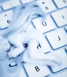 a close up of a keyboard with white keys