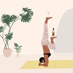 a woman doing a handstand in front of a potted plant with a bottle of wine