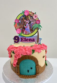 a birthday cake decorated with an image of the princess and the frog