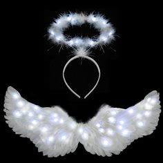 white angel wings and headband with light up lights on them, set against a black background