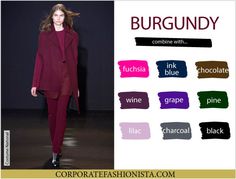 a woman is walking down the runway in burgundy