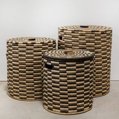 three woven baskets sitting next to each other