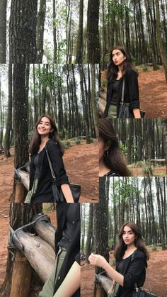 a woman standing in the middle of a forest with her hand on her hip and looking at the camera