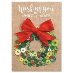 a christmas card with buttons and a red bow on it, which says wishing you the happest holidays