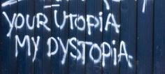 graffiti written on the side of a blue building that says your utopia is my dystopia