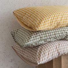 three pillows stacked on top of each other