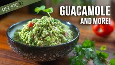 guacamole and more recipe in a bowl on a wooden table with tomatoes