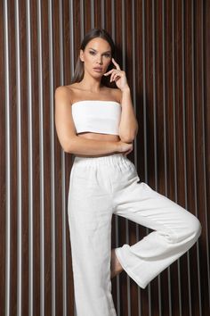 Full-length white 100% linen pants in white. High waist, drawstring waistband, wide legs with side-seam pockets. Regular fit   XS/S Waistband 65-75 cm/ 25,5-29,5 inches  Inside leg length 84cm/ 33 inches M/L  Waistband 75-85 cm/ 29,5-33,5 inches Inside leg length 76cm/33.5 inches Model's height: 173cm, 5' 8" wearing size XS/S Order preparing time: 1-3 working days Free worldwide delivery for all purchases  Delivery time: Europe: 2-5 working days USA: 2-4 working days Rest of the world: 2-5 worki White Linen Wide Leg Vacation Pants, White Linen Wide Leg Pants For Vacation, White Relaxed Fit Linen Bottoms, Chic White Linen Wide Leg Pants, High Waist Linen Wide Leg Loungewear Pants, White Linen Wide Leg Bottoms, White Linen Wide-leg Bottoms, Casual White Linen Wide Leg Pants, White Linen Wide Leg Casual Pants