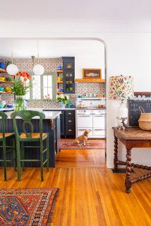 the kitchen is clean and ready for us to use it's wood flooring