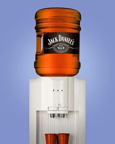 a jack daniels coffee machine with two red cups on it's front and bottom