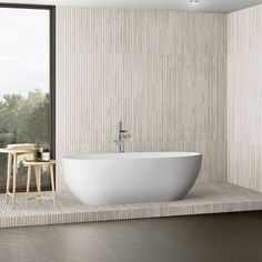 a large white bath tub sitting in a bathroom next to a tall glass window on the wall