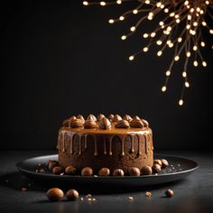 a chocolate cake sitting on top of a black plate next to a sprinkled chandelier