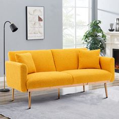 a living room with a yellow couch in it