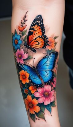 a woman's leg with butterflies and flowers on it