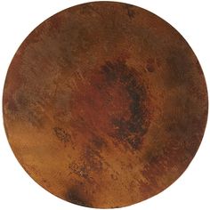 a round metal plate with rusted paint on it