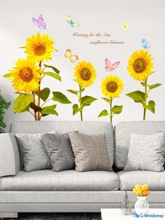 sunflowers and butterflies on the wall in a living room