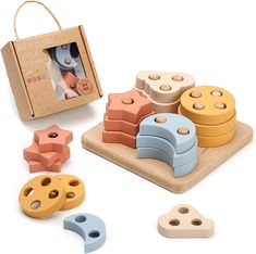 a wooden toy set with different shapes and sizes