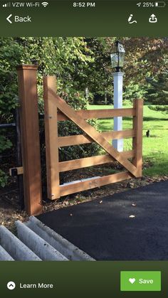 a wooden gate with a light on top