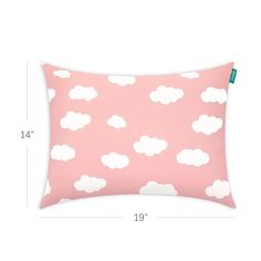 a pink pillow with white clouds on it and the measurements for each pillow in front