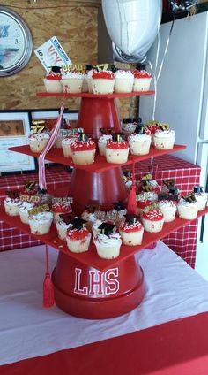 cupcakes are stacked on top of each other in the shape of a tower