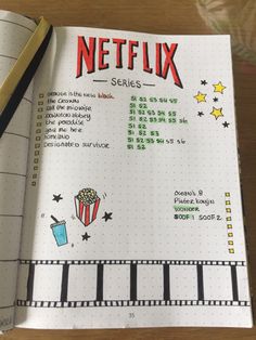 a notebook with the words netflix written on it and a pencil in front of it