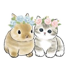 two cats with flowers on their heads sitting next to each other