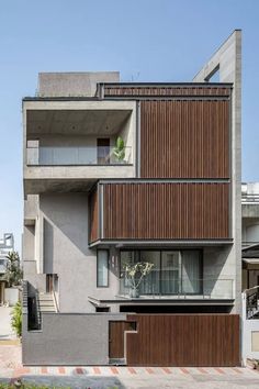 an apartment building with wooden slats on the side