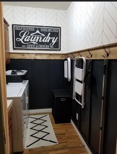 a kitchen with black cabinets and white appliances