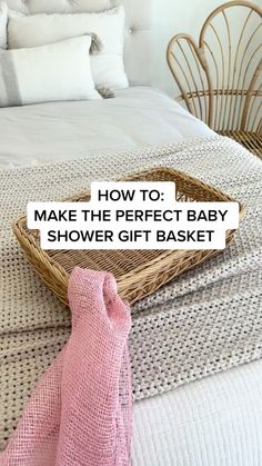 a wicker basket sitting on top of a bed with the words how to make the perfect baby shower gift basket