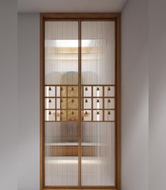 an empty room with glass doors and white walls