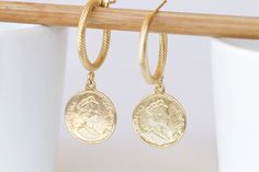 GOLD COIN EARRINGS, Coin Hoop Earrings,  Coin Jewelry,Dangle Coin Statement Earrings, Antique Coin Earrings for Women gift, Silver or Gold Details of ring: Metal: 24k gold plated \ antique silver plated Diameter of coin is 0.6 inch Adjustable ring The ring will package in a gift box Details of earrings:  Metal: 24k gold plated \ antique silver plated Diameter of coin is 0.6 inch Diameter of the hoop is 0.8 inch The rearrings will package in a gift box TO GET TO MY ETSY SHOP: https://www.etsy.com Gold-tone Huggie Earrings Gift, Gold Coin Pendant Earrings, Hallmarked Gold Huggie Earrings For Gift, Gold Plated Hallmarked Hoop Earrings As Gift, Gold Hallmarked Huggie Earrings For Gifts, Gold-tone Drop Huggie Earrings As A Gift, Coin Pendant Earrings As Gift, Coin Pendant Earrings For Gifts, Elegant Yellow Gold Earrings With Coin Pendant