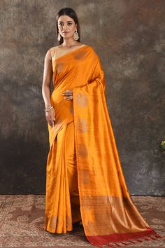 Shop beautiful mango yellow tussar Banarasi sari online in USA with antique zari buta. Be vision of elegance on special occasions in exquisite designer sarees, handwoven sarees, georgette sarees, embroidered sarees, Banarasi saree, pure silk saris from Pure Elegance Indian saree store in USA.-full view Gold Tussar Silk Pre-draped Saree With Zari Weaving, Festive Yellow Tussar Silk Pre-draped Saree, Yellow Tussar Silk Pre-draped Saree For Diwali, Traditional Yellow Raw Silk Pre-draped Saree, Gold Tussar Silk Pre-draped Saree With Cutdana, Orange Raw Silk Saree, Orange Tussar Silk Traditional Wear For Diwali, Gold Tussar Silk Bollywood Pre-draped Saree, Semi-stitched Orange Slub Silk Traditional Wear