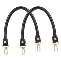 three black leather handles with gold hardware on each end and two metal hooks attached to them