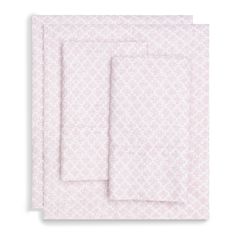 two sheets with pink and white designs on the front, one is folded in half