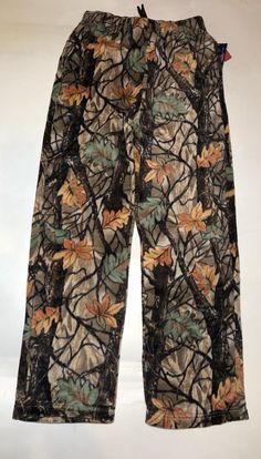 a pair of pants with leaves on them