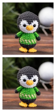 crocheted penguin with green shirt and yellow feet