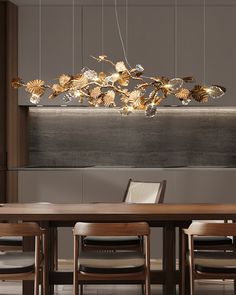 a dining room table with chairs and a chandelier hanging from it's ceiling