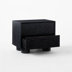 two black wooden drawers with one drawer open and the other closed, on a white background