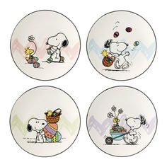 four plates with cartoon characters on them in different colors and sizes, one has a dog carrying a basket