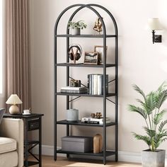 a living room filled with furniture and a book shelf