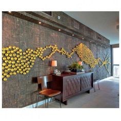 the wall is decorated with yellow flowers and vases