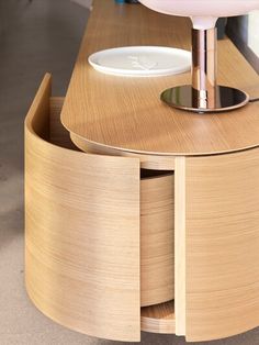 a bathroom sink sitting on top of a wooden counter next to a white faucet