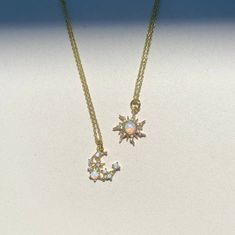 Dainty Opal 14K Gold-plated Necklace * White Opal Pendant Delicate and beautiful opal sun and moon, surrounded by cubic zirconia! 🌼 Our Guarantees: -Customers are offered a 30 day product guarantee, if anything happens with your product that leads to dissatisfaction we will replace the product for free! -We accept all returns/exchanges within 14 days after receiving your order. 🌼 Material Information: -The charms are made from a lab-made opal, cubic zirconia set in 14K-gold plated brass, they Couples Matching Necklace, Sun And Moon Jewelry Necklaces, Moon Sun Jewelry, Sun And Moon Matching Necklaces, Moon And Sun Jewelry, Moon Opal Necklace, Sun And Moon Necklaces, Moon And Sun Necklace, Sun And Moon Jewelry