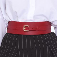 Dress up a simple outfit with this elegant and versatile wide waist belt. Fashioned in stunning smooth leather, the Athea belt adds the finishing touch to any outfit. Handcrafted in EU using Italian Full Grain Leather and Nickel Plated Hardware        It is recommended to clean the products after each wear as follows:  The leather parts should be wiped with a soft cloth, slightly damp, and let dry at room temperature the metallic elements should be well wiped with a dry cloth  It is NOT recommen Chic Workwear Belts With Self Belt, Formal Leather Corset Belt With Belt Loops, Classic Red Belt Buckles With Removable Belt, Elegant Leather Corset Belt For Formal Wear, Elegant Leather Corset Belt For Formal Occasions, Chic Leather Corset Belt With Belt Loops, Elegant Corset Belt With Belt Loops, Elegant Office Belts, Chic Leather Belt For Office