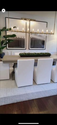 an image of a dining room with white chairs