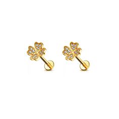 gold plated earrings with crystal stones in the shape of four leaf clovers on white background