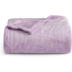 a purple blanket that is laying on top of a white surface and it's folded up